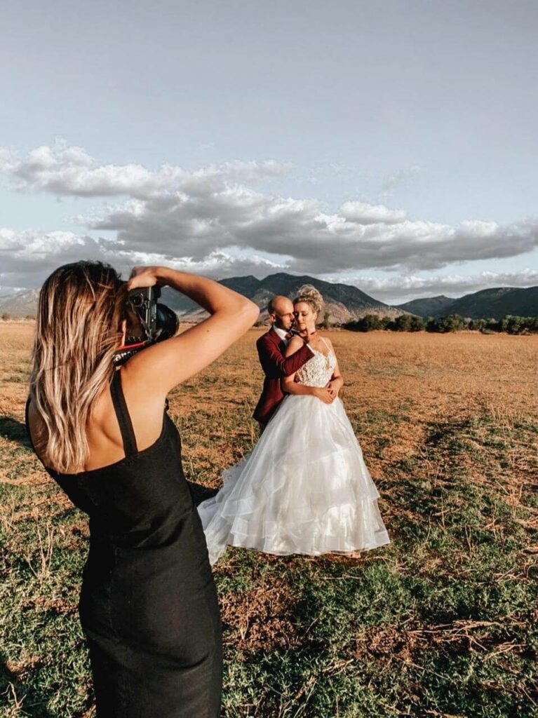 Interior of glamping tent with two full-size single beds and hotel linen